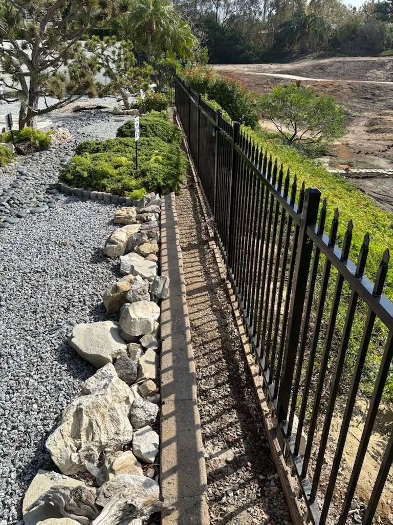 Completed Iron Master galvanized iron fence with security spikes after final inspection