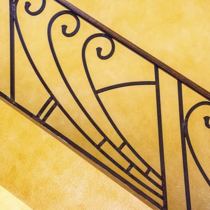 close up of Art Deco starcase railing.